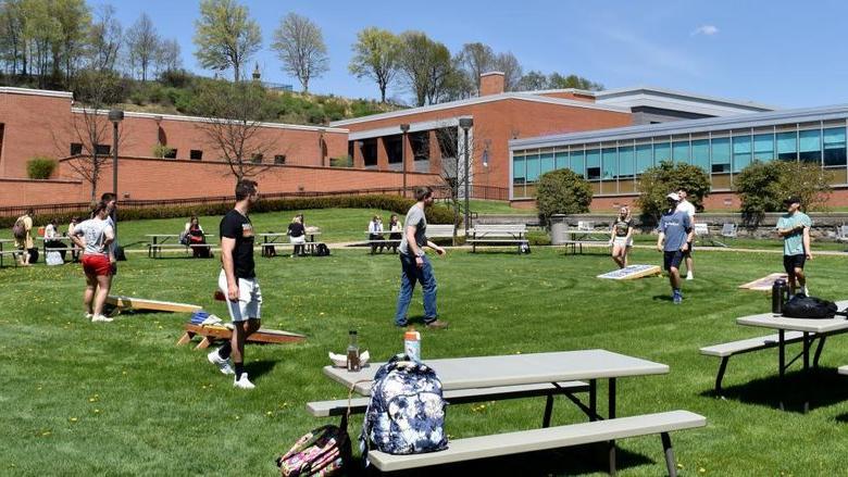 Students at 365英国上市杜波依斯分校 enjoy some games outside on the DEF Lawn during the Earth Day celebration on campus